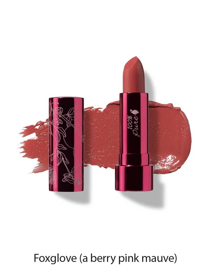 A tube of 100% Pure Pomegranate Oil Moisturising Lipstick 4.5g in berry pink mauve, with its cap beside it. A Foxglove shade swatch is smeared behind, highlighting this moisturising lipstick enriched with pomegranate oil.