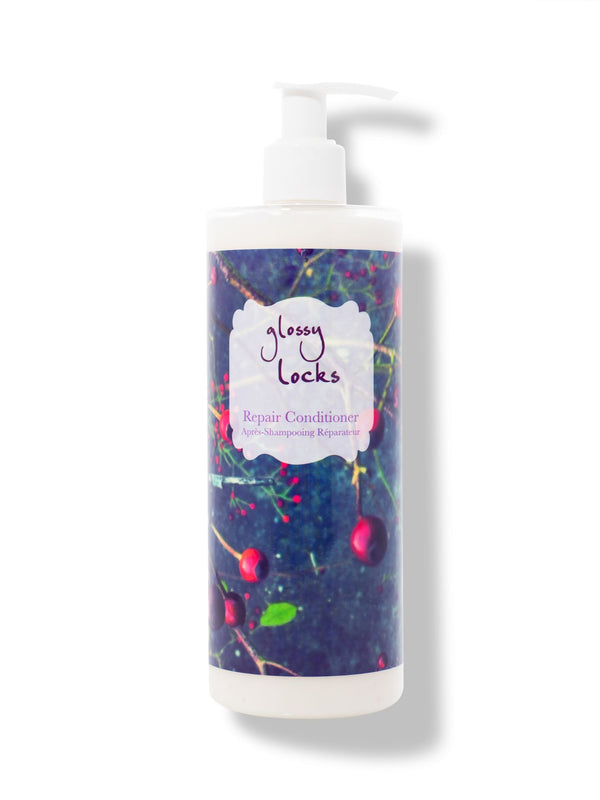 100% Pure Glossy Locks Repair Conditioner in a white pump bottle with a dark blue label covered in colourful fruit and plant illustrations.