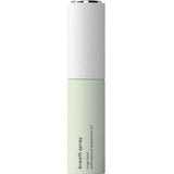 A tall, slim cylindrical bottle of breath spray with a white upper section and a pale mint green lower section, featuring black text that reads 'breath spray' and 'with natural spearmint oil'.