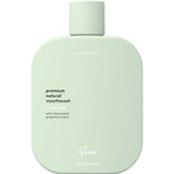 Mint green bottle of Gem mouthwash on a white background