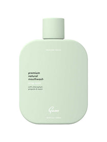 Mint green bottle of Gem mouthwash on a white background