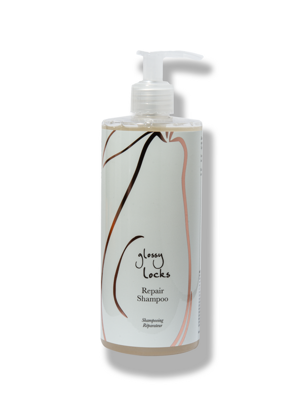 100% Pure Glossy Locks Repair Shampoo in a clear pump bottle containing pale golden liquid, with a mint-green label, curved line drawings and a white pump.