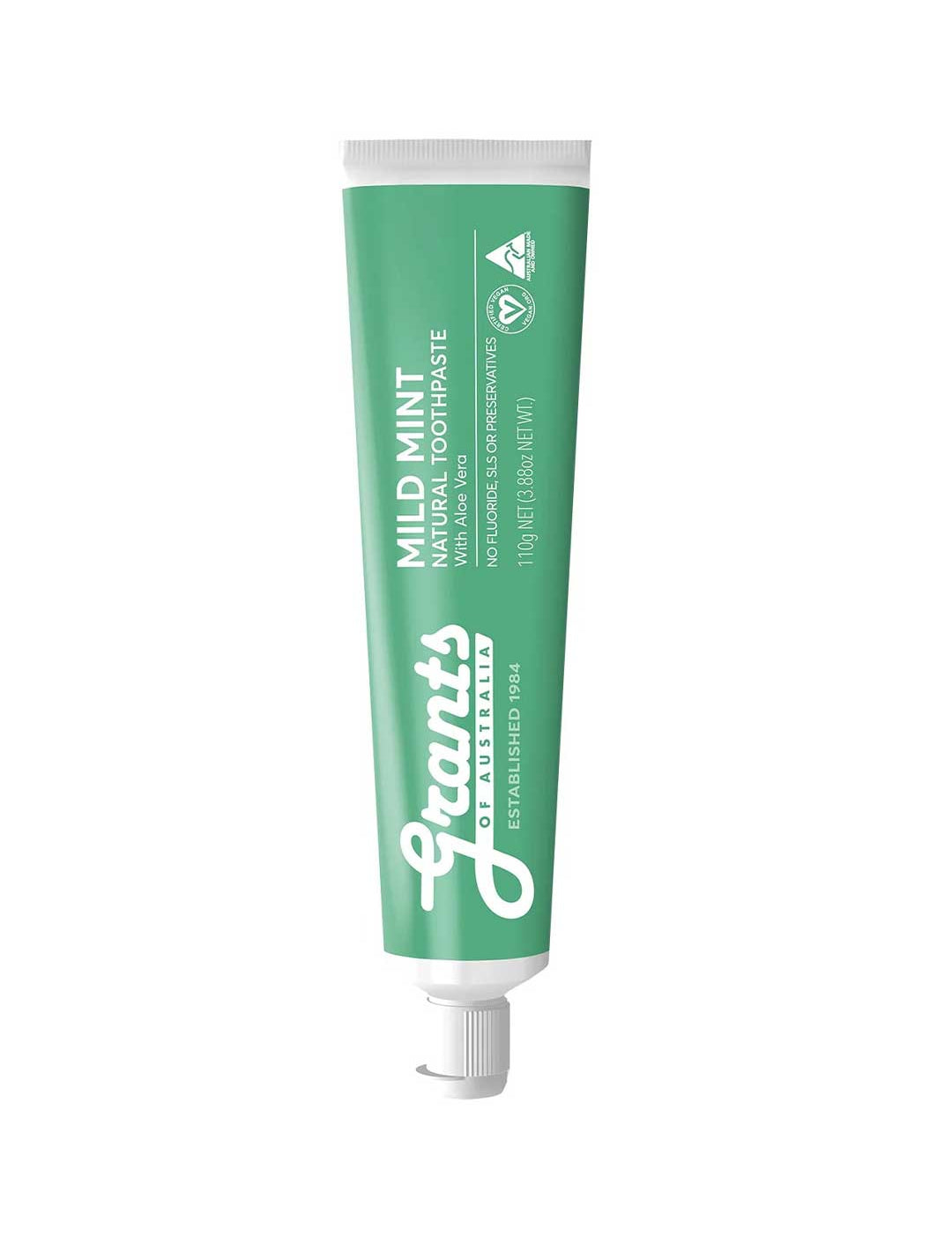 Green tube of Grants Mild Mint toothpaste on a white background