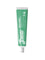 Green tube of Grants Mild Mint toothpaste on a white background