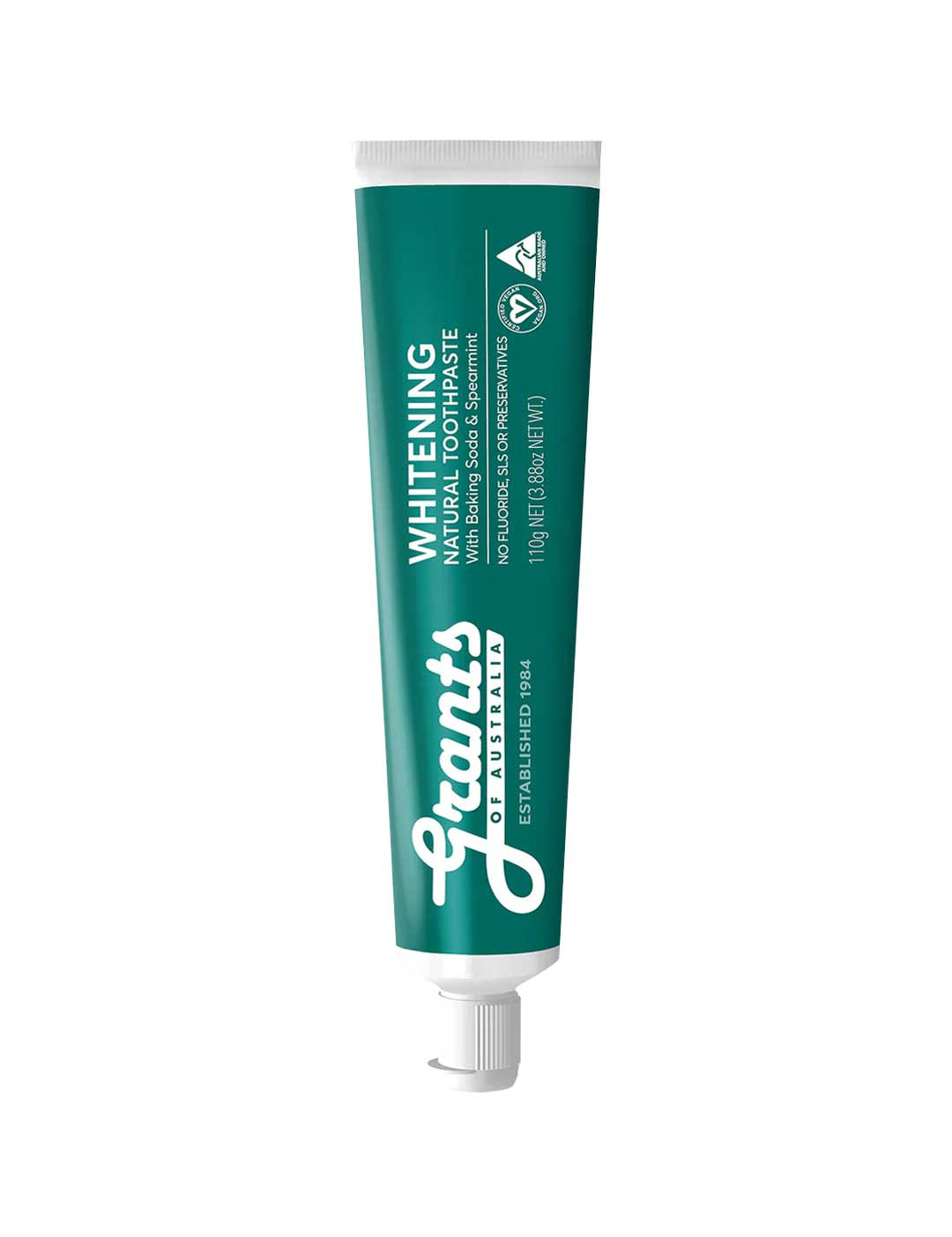 Green tube of Grants whitening natural toothpaste on a white background
