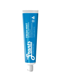 Blue tube of Grant's Fresh Mint toothpaste on a white background