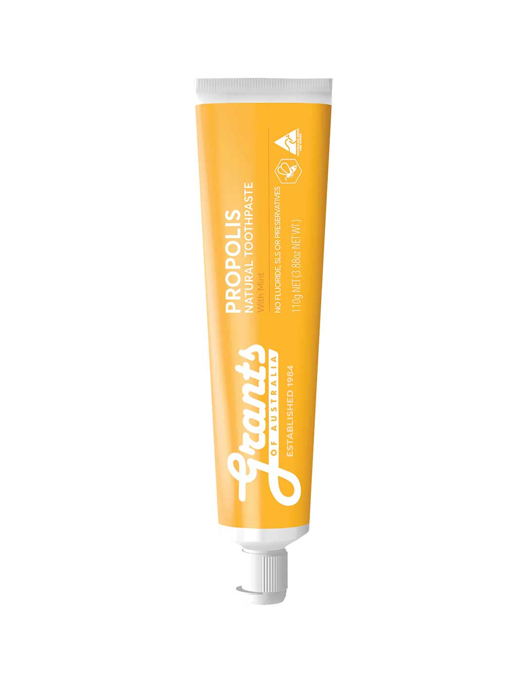 Orange tube of Grant's Propolis toothpaste on a white background