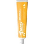Orange tube of Grant's Propolis toothpaste on a white background