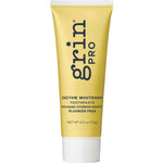Yellow tube of grin Pro enzyme whitening toothpaste on a white background