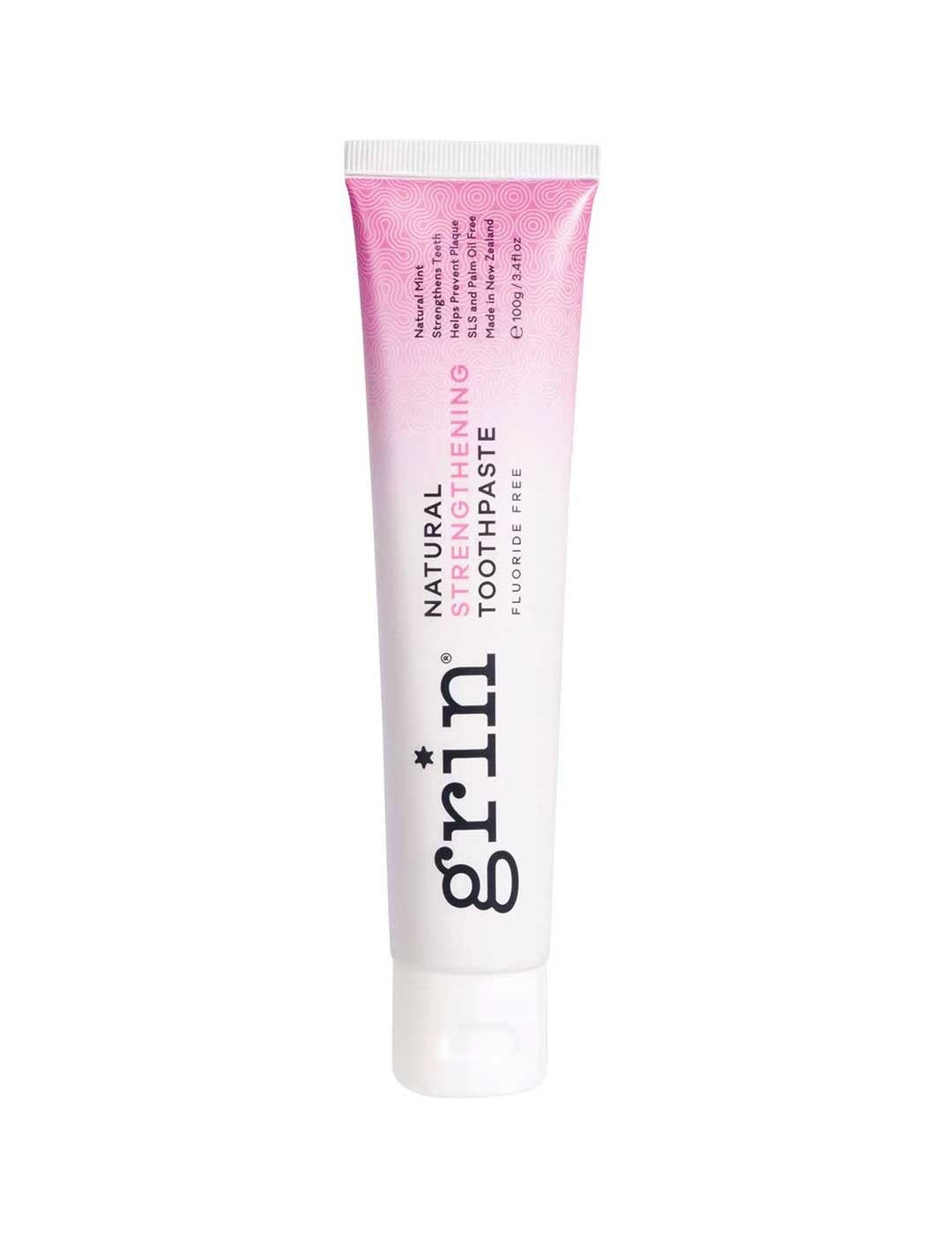 Tube of grin natural strengthening toothpaste on a white background