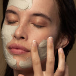 Model applying Antipodes Halo Skin-Brightening Facial Mud Mask