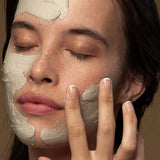 Model applying Antipodes Halo Skin-Brightening Facial Mud Mask