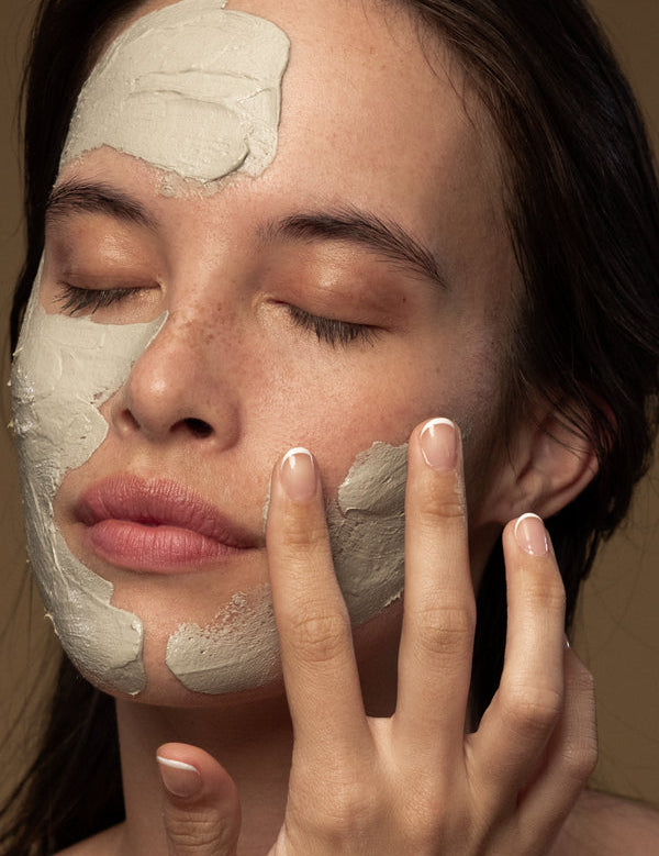 Model applying Antipodes Halo Skin-Brightening Facial Mud Mask