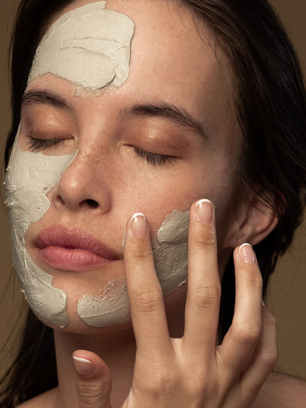 Model applying Antipodes Halo Skin-Brightening Facial Mud Mask