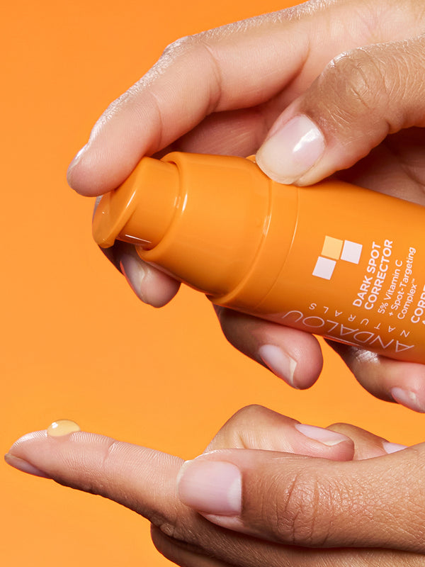 Hand dispensing Andalou Brightening Dark Spot Corrector with 5% Vitamin C