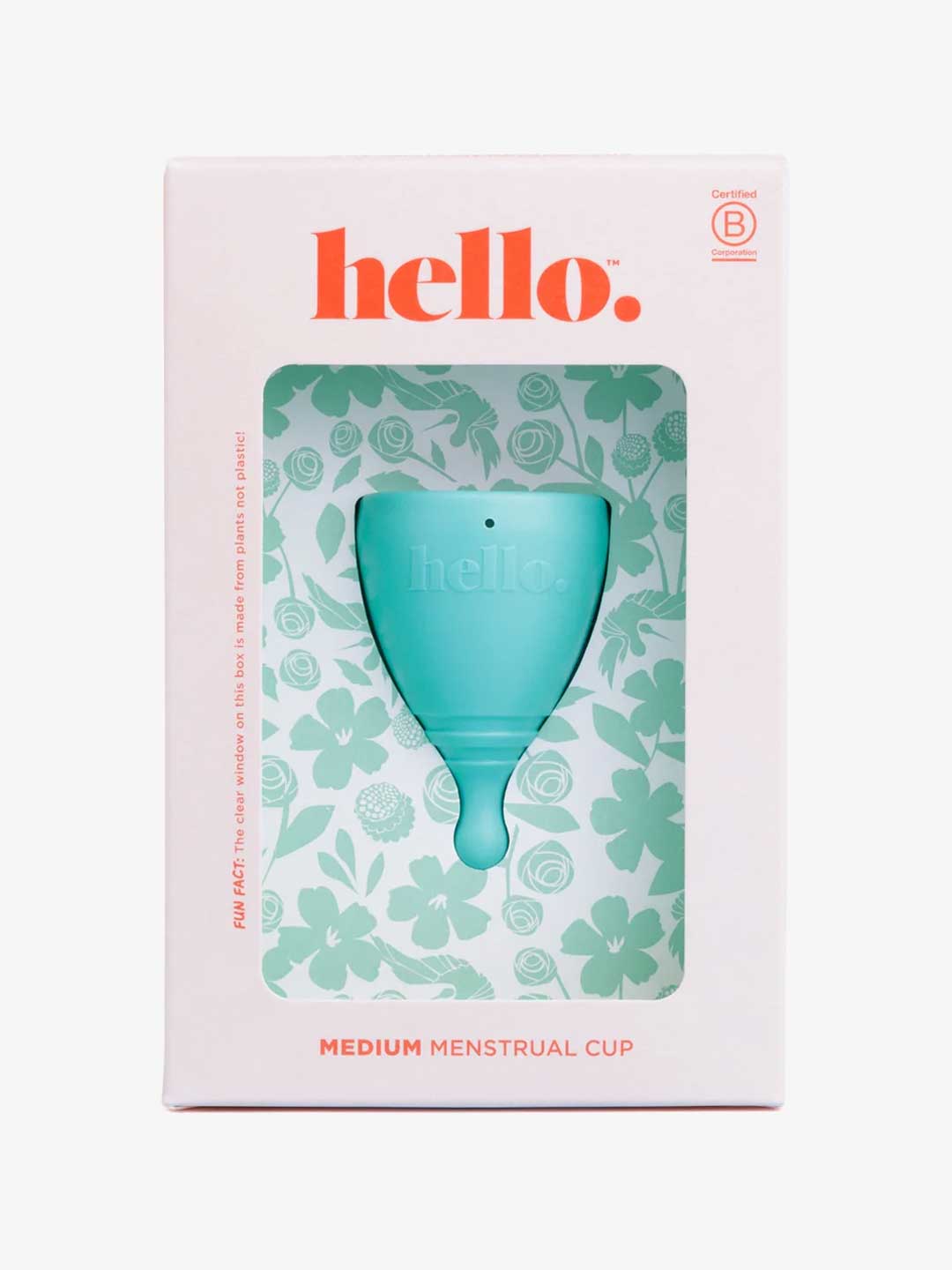 The Hello Period Cup Medium is a teal menstrual cup made from medical-grade TPE, in floral packaging labeled "hello." and "MEDIUM MENSTRUAL CUP," displayed in a white and pink box with a clear window showing the reusable period cup inside.