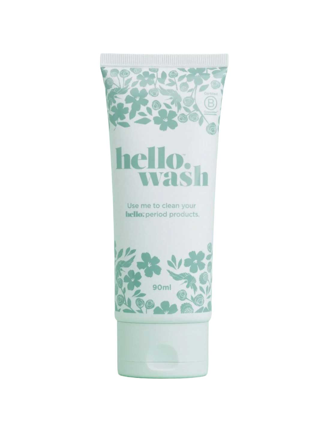 A white tube with green floral designs labeled Hello Wash 90ml, a natural menstrual product cleaner. The text says, "Use me to clean your hello: period products.