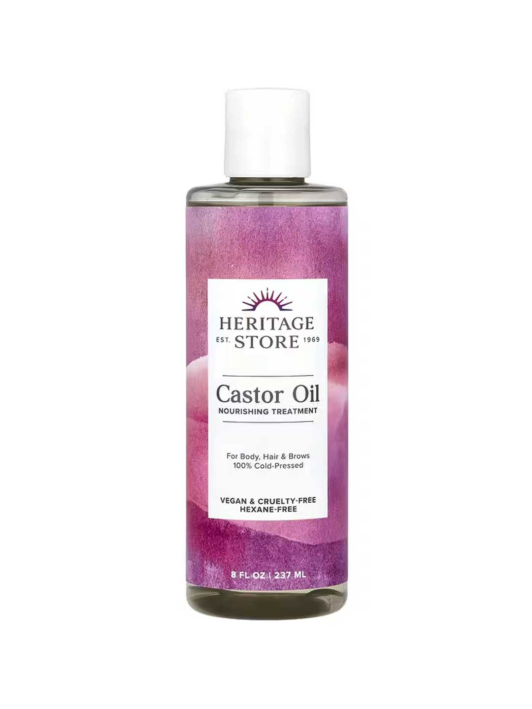 A bottle of Heritage Store Castor Oil Nourishing Treatment 237ml with a purple label, 100% cold-pressed, vegan, cruelty-free, hexane-free—ideal for body care, hair growth, and brows.