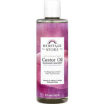 A bottle of Heritage Store Castor Oil Nourishing Treatment 237ml with a purple label, 100% cold-pressed, vegan, cruelty-free, hexane-free—ideal for body care, hair growth, and brows.