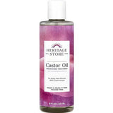A bottle of Heritage Store Castor Oil Nourishing Treatment 237ml with a purple label, 100% cold-pressed, vegan, cruelty-free, hexane-free—ideal for body care, hair growth, and brows.