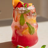 Berry mocktail made with Nutra Naturals Protein Water Berry Bliss
