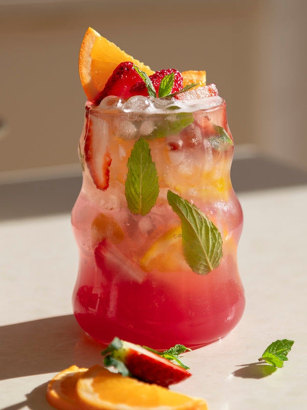 Berry mocktail made with Nutra Naturals Protein Water Berry Bliss