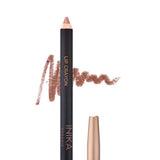 A brown INIKA Organic Lip Crayon 6.7g with gold labeling is displayed with its cap removed and a swatch behind it; the shade "Honey" is shown below, emphasizing this long-lasting lip liner’s natural, organic appeal.