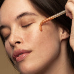 Model applying Antipodes Hosanna Collagen-Plumping Water Serum