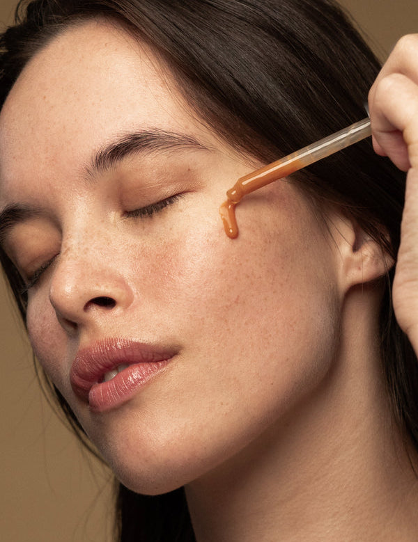 Model applying Antipodes Hosanna Collagen-Plumping Water Serum