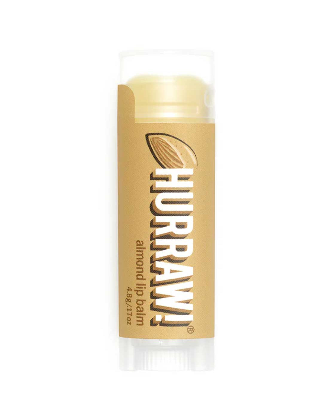 A 4.8g Hurraw! Organic Lip Balm - Almond, with a light brown label showing an almond and white text, stands upright on a white background.