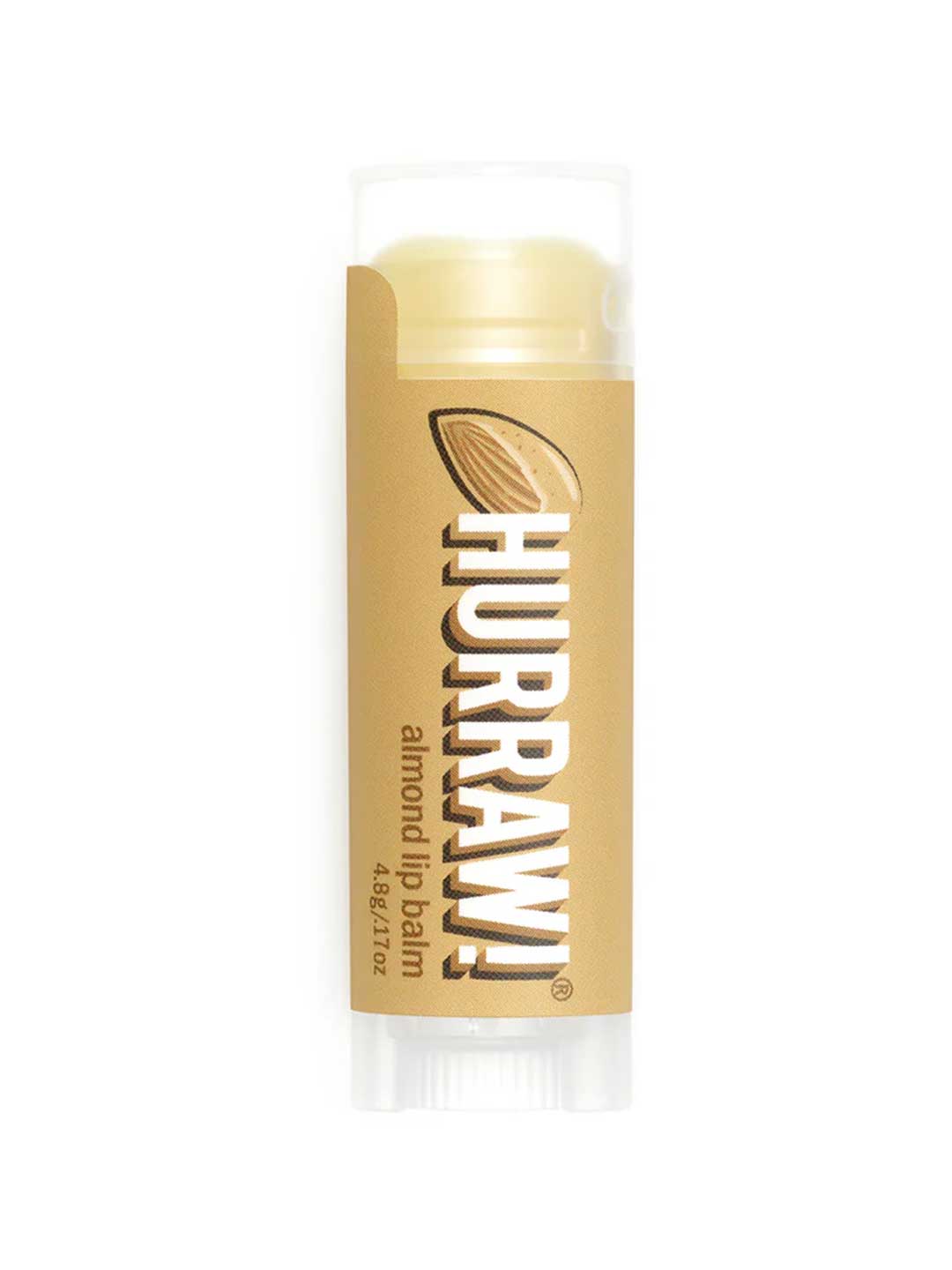 A 4.8g Hurraw! Organic Lip Balm - Almond, with a light brown label showing an almond and white text, stands upright on a white background.