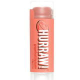 A tube of Hurraw! Organic Lip Balm - Grapefruit 4.8g with a peach label, bold white and black text, and a grapefruit graphic. The vegan balm has a clear cap, showing the nourishing formula inside.