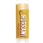 A yellow tube of Hurraw! Organic Lip Balm - Pineapple 4.8g features a pineapple wedge graphic and notes papaya content; this vegan balm has a clear cap and base.