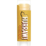 A yellow tube of Hurraw! Organic Lip Balm - Pineapple 4.8g features a pineapple wedge graphic and notes papaya content; this vegan balm has a clear cap and base.