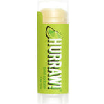 A partially opened Hurraw! Organic Lip Balm - Lime 4.8g shows the light yellow vegan balm inside. The tube has a green label with a lime slice graphic.