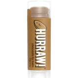 A 4.8g tube of Hurraw! Organic Lip Balm in Chocolate flavor, with a brown label featuring a cocoa bean illustration, stands upright against a white background.