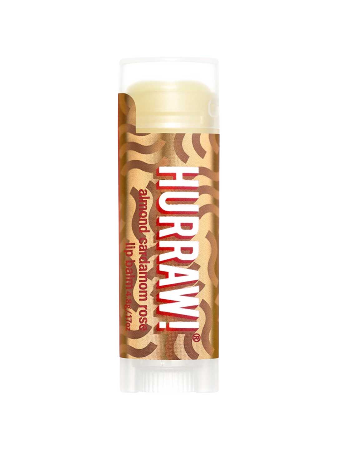 A 4.8g Hurraw! Vata Lip Balm Almond Cardamom & Rose stands upright on a white background, featuring a brown and gold wavy label—an organic lip balm inspired by almond, cinnamon, cardamom, and rose notes.