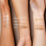 Three forearms of different skin tones show four swatches—beige, light, medium, and tan—illustrating how each Hyaluronic Anti-Pollution CC Cream SPF15 40ml shade looks on various skin colors.