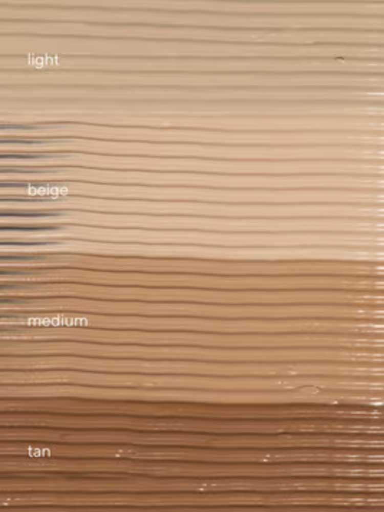 A textured background of horizontal stripes in diverse skin tones highlights the versatility of Hyaluronic Anti-Pollution CC Cream SPF15 40ml, a tinted moisturiser offering anti-pollution skincare benefits.