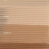 A textured background of horizontal stripes in diverse skin tones highlights the versatility of Hyaluronic Anti-Pollution CC Cream SPF15 40ml, a tinted moisturiser offering anti-pollution skincare benefits.