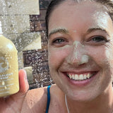 SunButter Deep Cleansing Powder held beside face