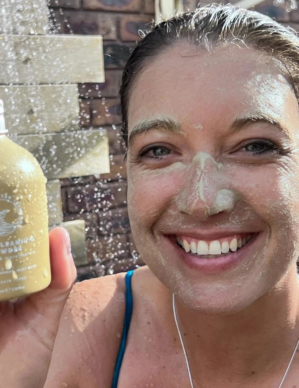 SunButter Deep Cleansing Powder held beside face