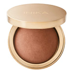 The INIKA Organic Baked Mineral Bronzer - Sunbeam 9g features a gold compact with a dome-shaped bronzer inside, ideal for a radiant sun-kissed look. The lid displays "INIKA" in gold lettering.