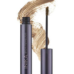 A tube of INIKA Organic Brow Perfector 6.5ml with its wand applicator removed sits in front of a light brown swatch. The shade name "Birch" is displayed below the image.