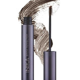 A tube of INIKA Organic Brow Perfector 6.5ml in Espresso, uncapped to show the brush applicator, displayed in front of a brown natural eyebrow gel swatch.