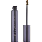 The INIKA Organic Brow Perfector 6.5ml stands upright without its cap, revealing a small brush applicator coated in brown product against a white background.