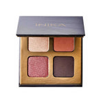 The INIKA Organic Eyeshadow Quad - Flowers 8g features four vegan, pressed mineral shades—shimmery beige, matte terracotta, shimmery rose, and matte dark brown—in a sleek gold and black compact.