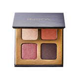 The INIKA Organic Eyeshadow Quad - Flowers 8g features four vegan, pressed mineral shades—shimmery beige, matte terracotta, shimmery rose, and matte dark brown—in a sleek gold and black compact.