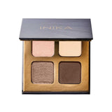 The INIKA Organic Eyeshadow Quad - Wind 8g features four vegan shades—light pink, beige, shimmery bronze, and dark brown—in a gold and black case with a partially open lid, perfect for creating effortless looks.