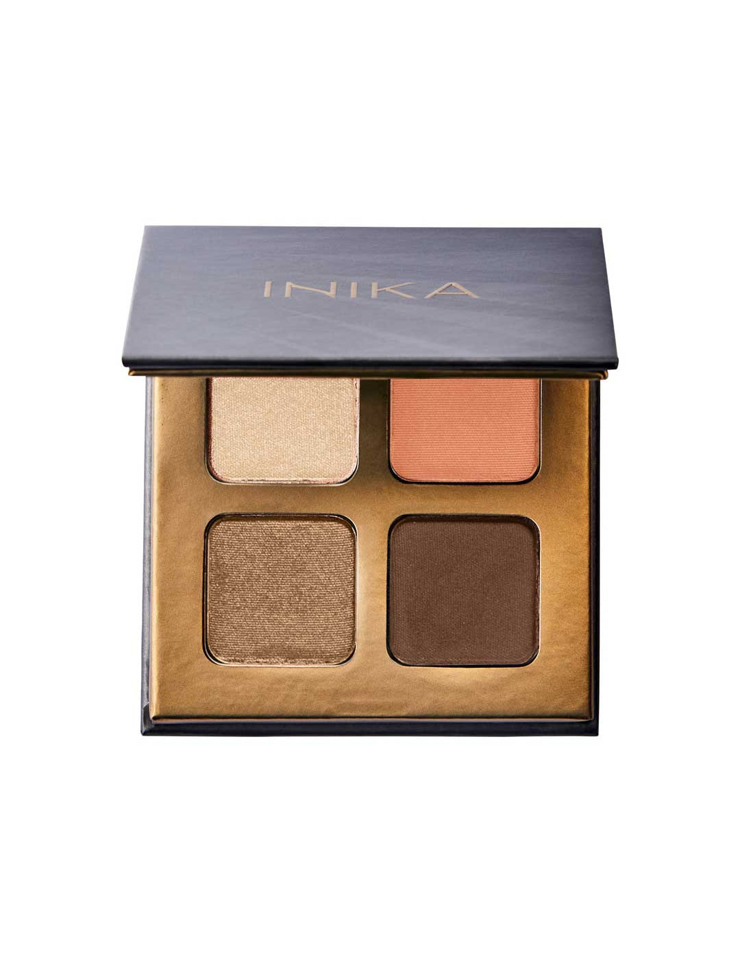 The INIKA Organic Eyeshadow Quad - Sunset 8g offers four talc-free mineral shades—light gold, peach, bronze, and dark brown—in a chic gold-trimmed case with a black lid labeled INIKA.